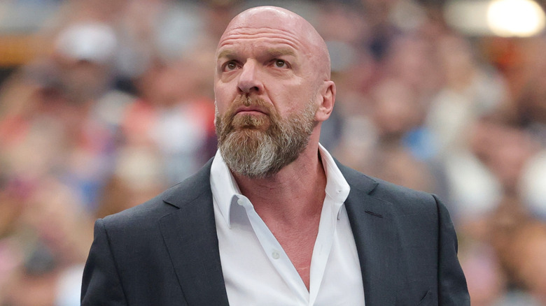 Triple H is looking off into the distance