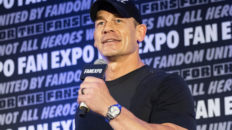 John Cena is holding a microphone
