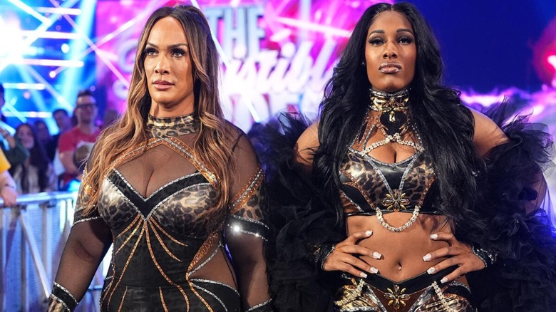 Nia Jax and Lash Legend head down the ramp to the ring before a match on 
