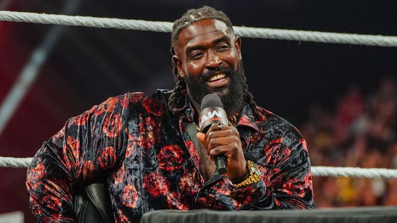 Oba Femi smiles while cutting a promo on Bron Breakker during a contract signing segment on "WWE Raw."