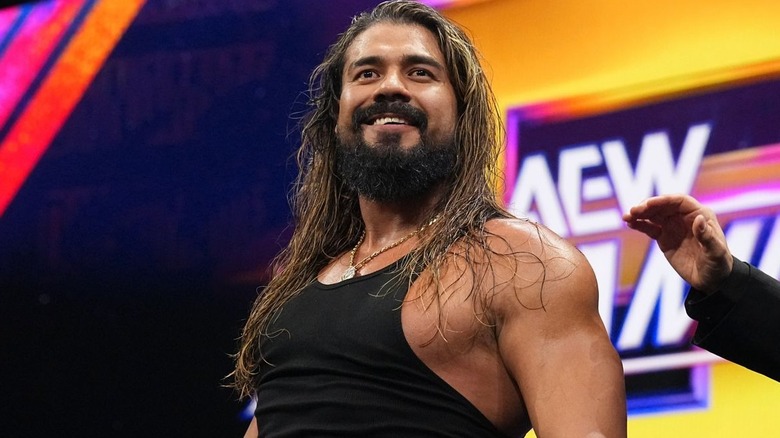 Andrade is wearing a black tank top