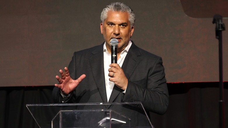 WWE President Nick Khan speaks on behalf of the company during a press event