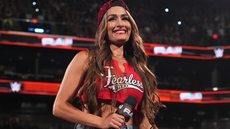 Nikki Bella holding a microphone