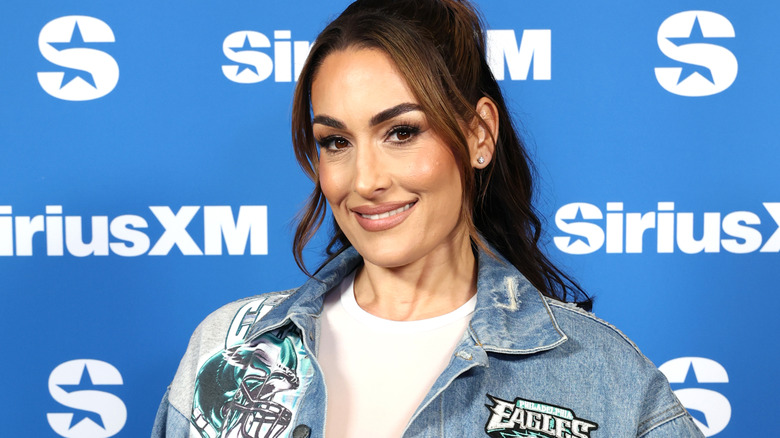Nikki Bella wearing a denim jacket