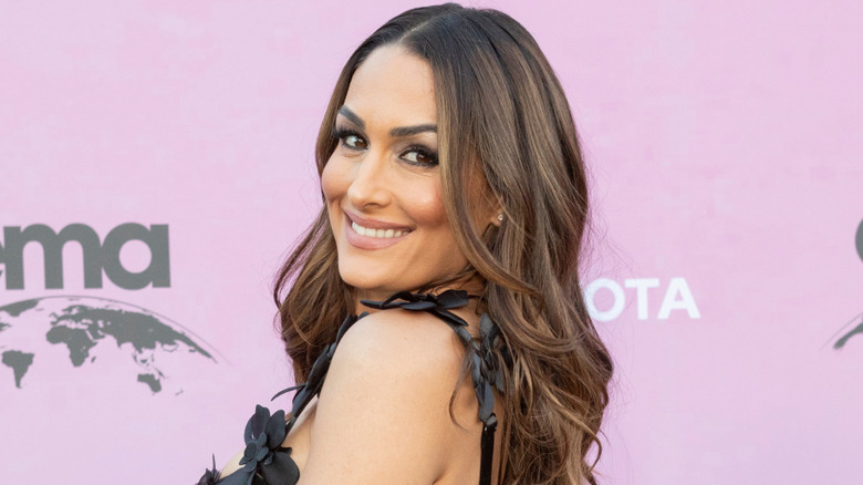 Nikki Bella looking over her shoulder