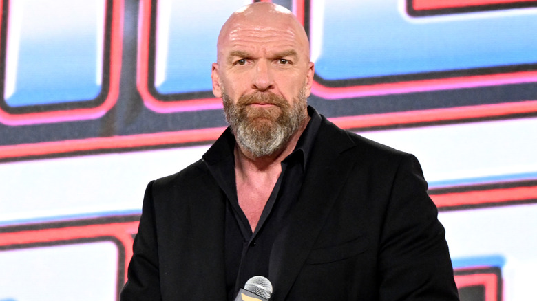 Triple H wearing a suit