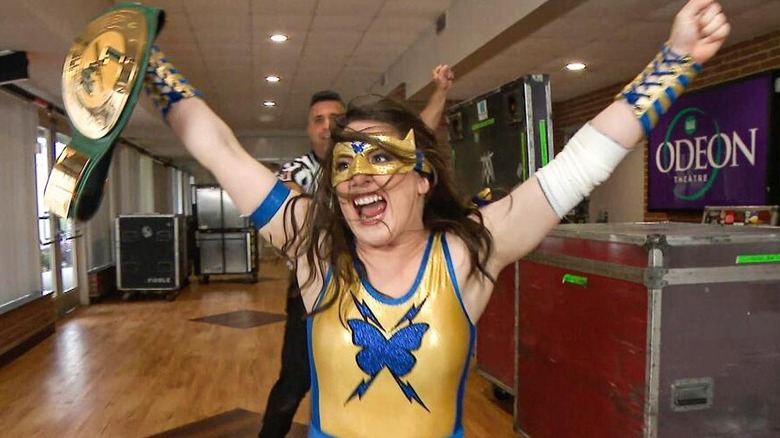 Former WWE star Nikki A.S.H/Cross celebrates winning the 24/7 Championship backstage minutes after capturing it