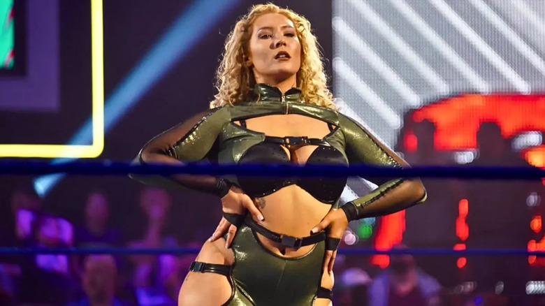 Nikkita Lyons wearing olive green ring gear