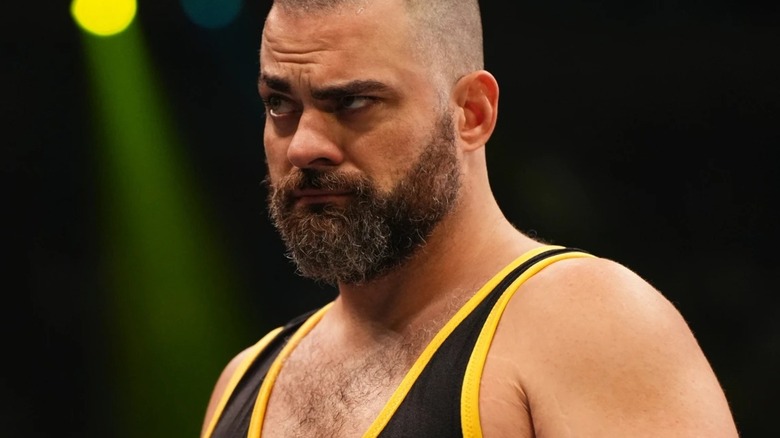 Eddie Kingston with one raised eyebrow wearing his wrestling attire