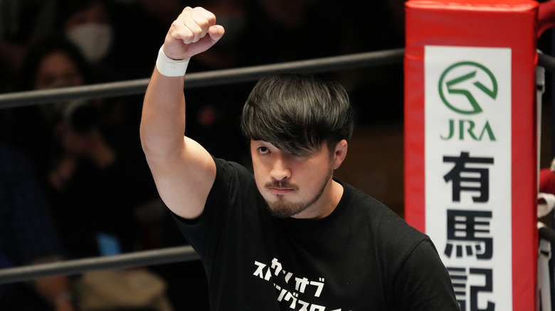 Ren Narita raising his right arm in the ring
