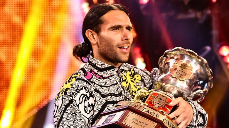 Noam Dar holding the NXT Heritage Cup