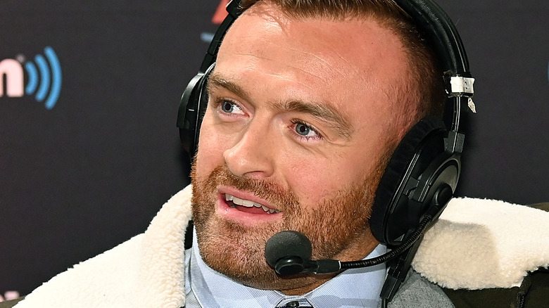 Nick Aldis speaking on a headset