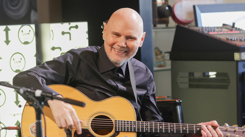 William Patrick Corgan plays the guitar