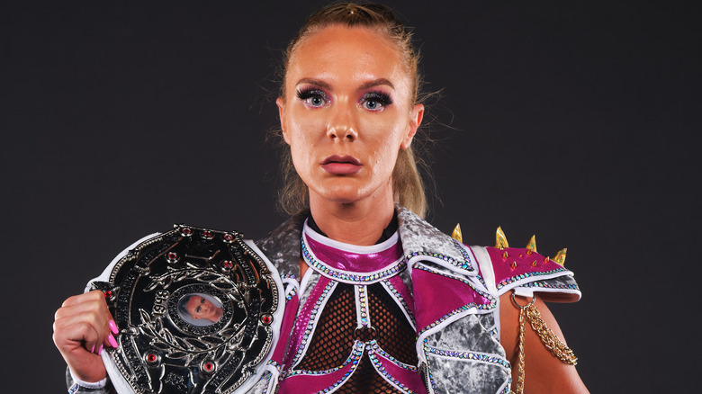 NWA Kamille posing title belt