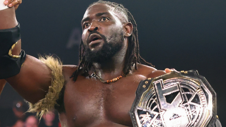 oba Femi holding NXT Championship