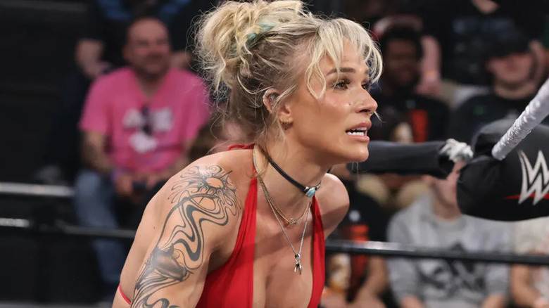 Sol Ruca is wearing a red halter top