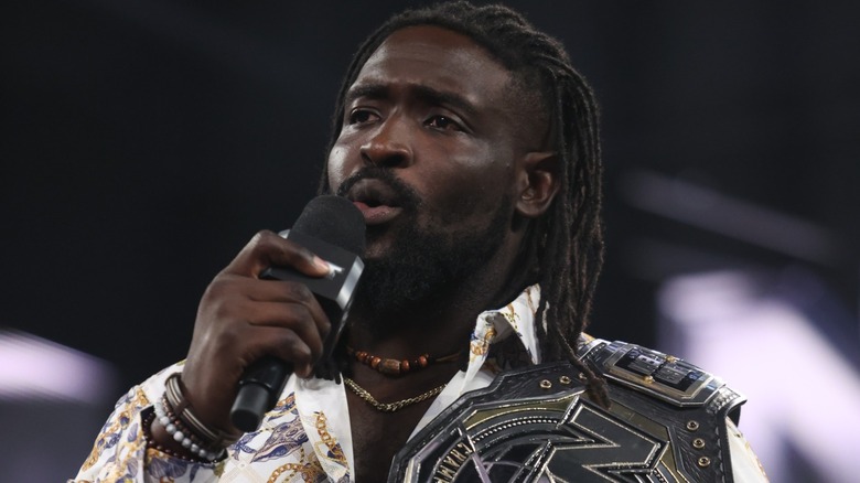 Oba Femi talking into a microphone
