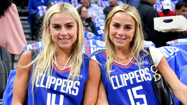 The Cavinder Twins Pose At A Basketball Game