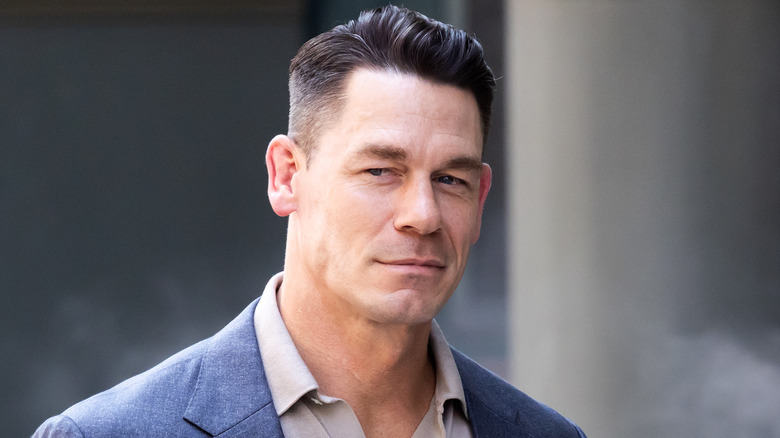John Cena smirking in a suit