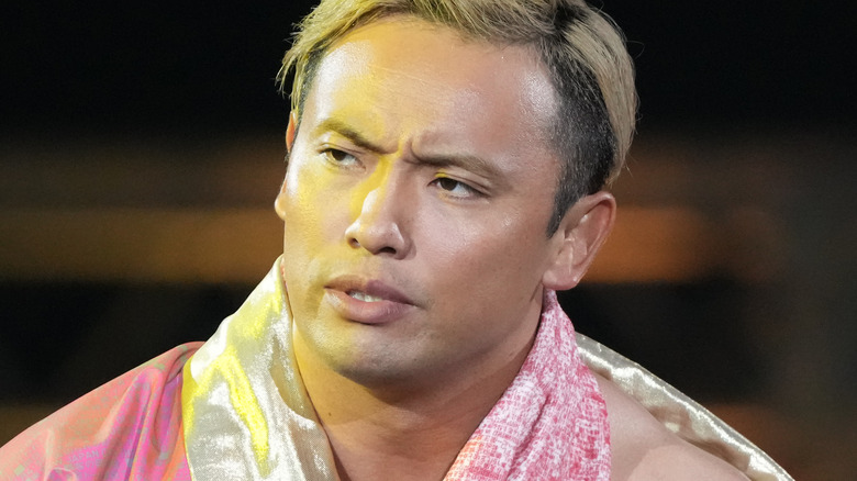 Kazuchika Okada posing during his entrance NJPW