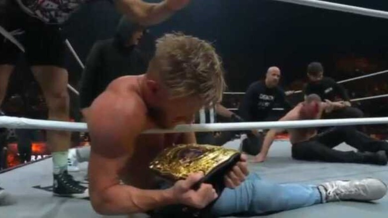 Orange Cassidy holding the title