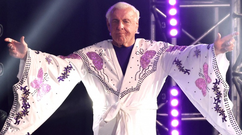 Ric Flair makes his ring entrance in his robe