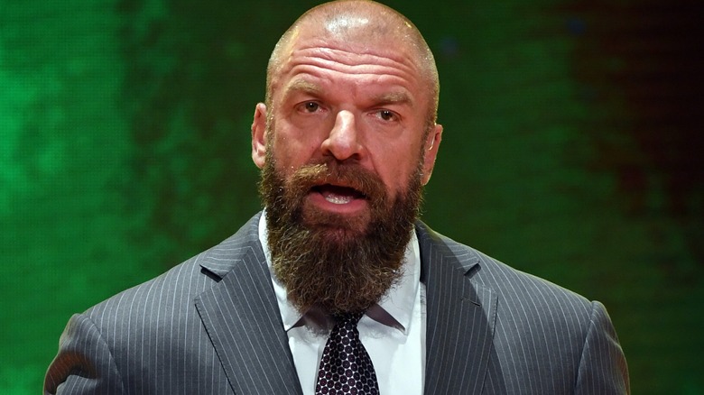 Triple H wearing a suit