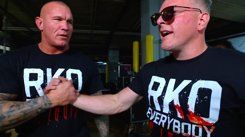 Randy Orton and Pat McAfee shake hands