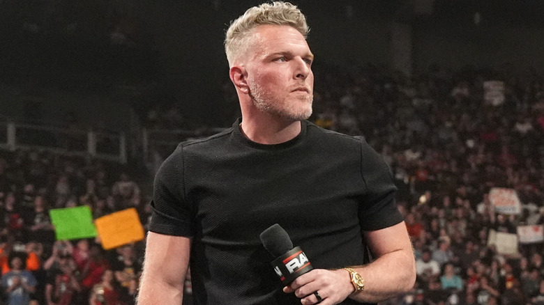 Pat McAfee holding a microphone