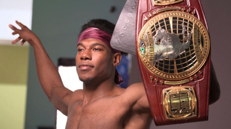 Velveteen Dream posing with NXT North American Championship