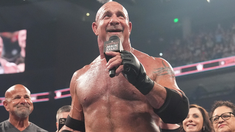 Goldberg holding a microphone