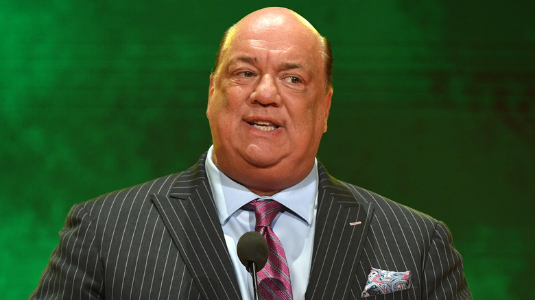 Paul Heyman wearing a striped suit