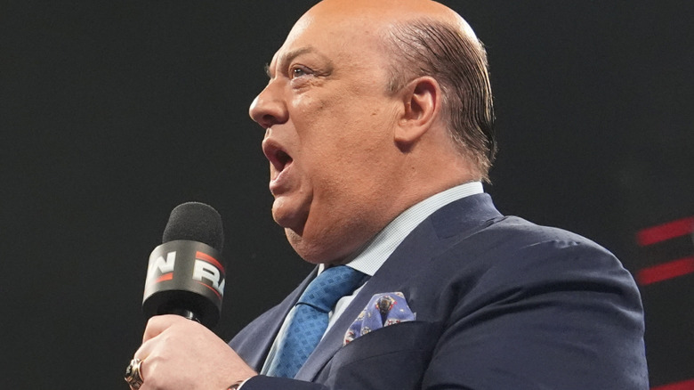 Paul Heyman holding a microphone