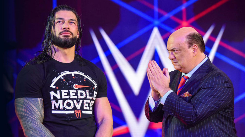 Paul Heyman praying to Roman Reigns