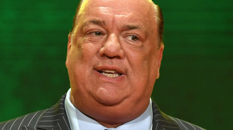 Paul Heyman wearing a suit