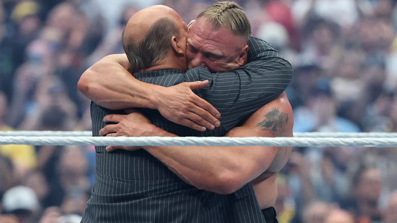 Paul Heyman hugs his former client Brock Lesnar after losing to Oba Femi at WrestleMania 42, marking his last in-ring match