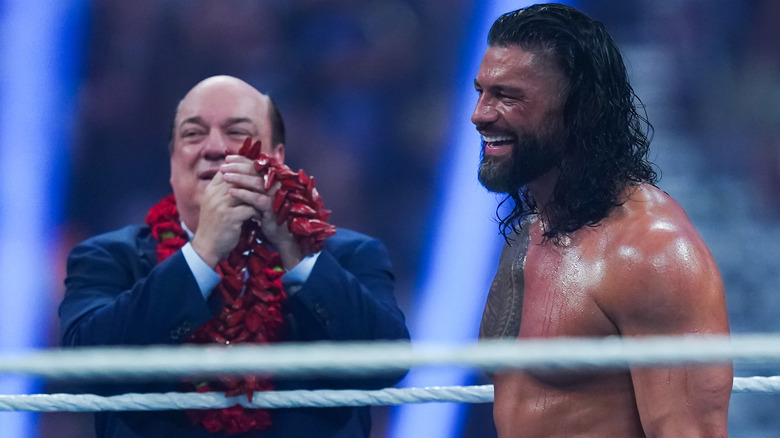 Paul Heyman and Roman Reigns smiling