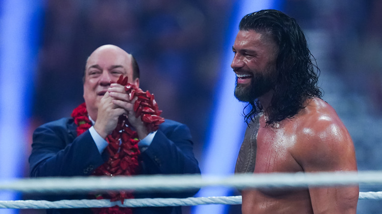 Paul Heyman and Roman Reigns smiling