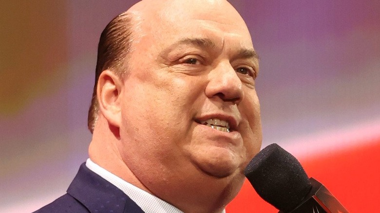 Paul Heyman holding a mic