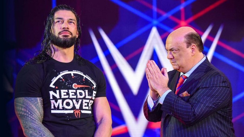 Roman Reigns and Paul Heyman enter together