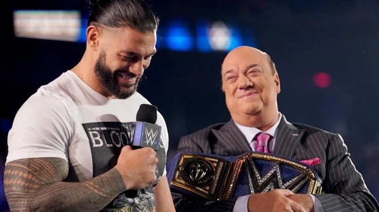 Roman Reigns and Paul Heyman smiling