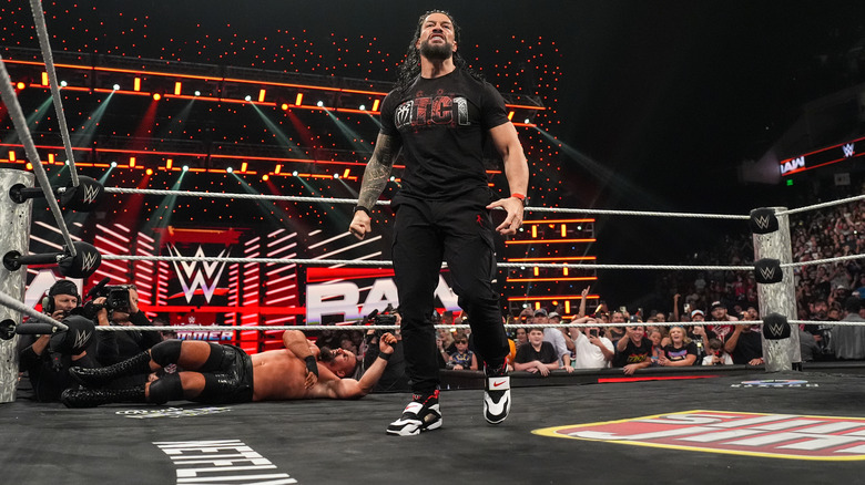 Roman Reigns standing tall after taking Bron Breakker out during 