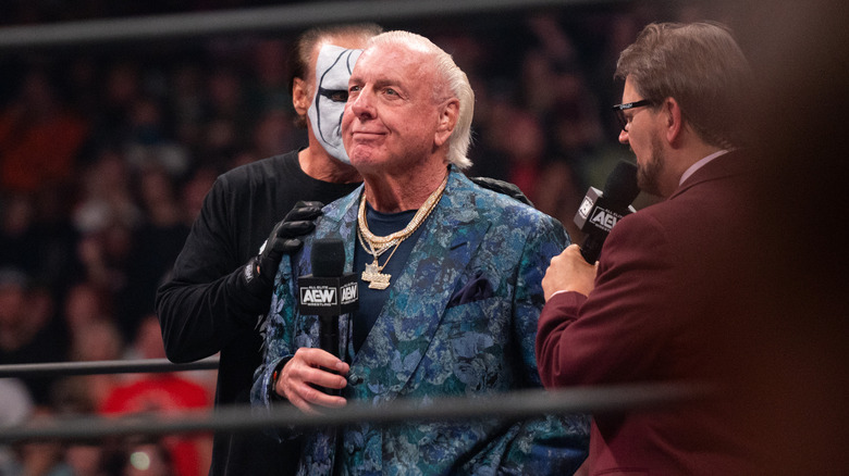 Ric Flair alongside Sting and Tony Schiavone