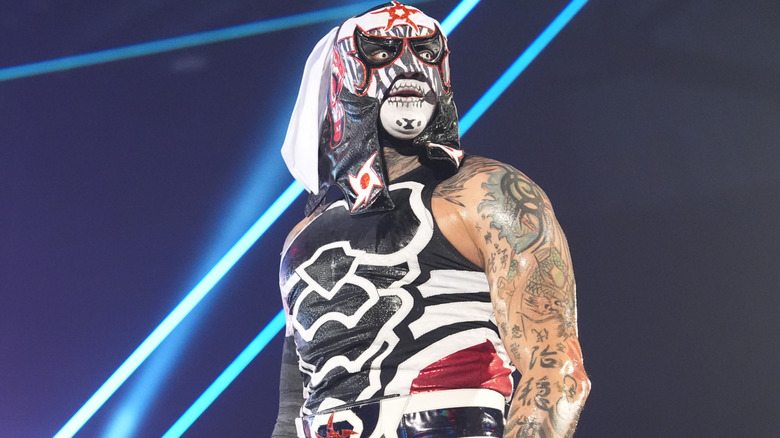 Penta wearing face paint and a mask