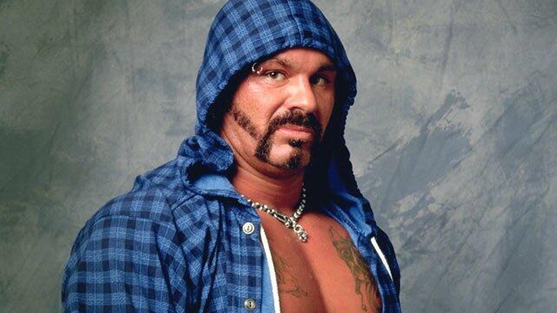 Perry Saturn posing with a hoodie during his WCW tenure.