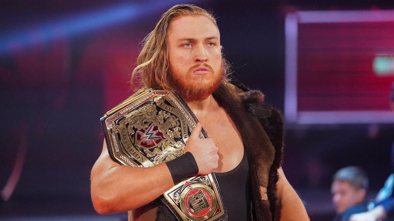 Pete Dunne holding NXT UK Championship