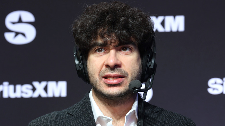 Tony Khan at a SiriusXM event with a headset on