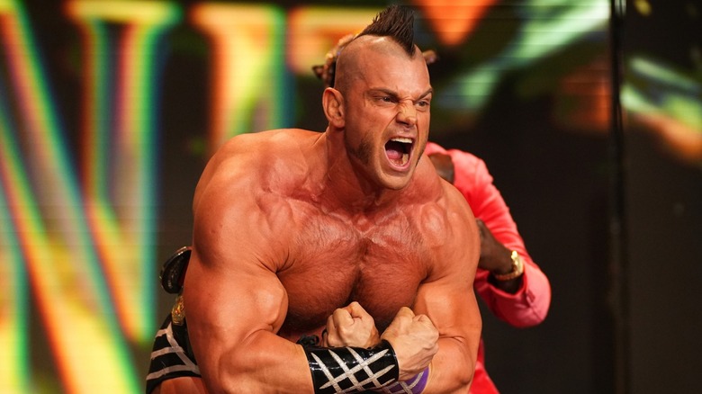 Brian Cage flexes