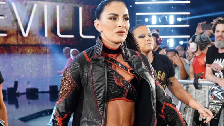 Sonya Deville heads down to the ring, flanked by Zoey Stark and Shayna Baszler, for a match on WWE programming.