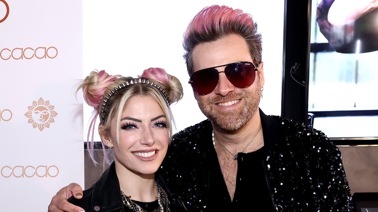 Alexa Bliss and her husband Ryan Cabrera smiling 